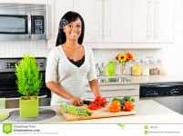 Young Woman Cutting Vegetables In Kitchen Royalty Free Stock Photo - Image: 17802305 Young woman cutting vegetables in kitchen