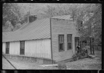 Farmhouse with false front resembling a store, on main highway between Morgantown and Elkins, West Virginia. Someone lived in one... 