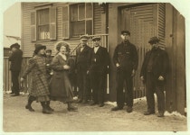 Young girls running gauntlet of men making remarks (sometimes vile). Location: New Bedford, Massachusetts. | Library of Congress... 