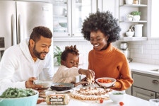 Download Cooking together makes for a happy family Wallpaper | Wallpapers.com