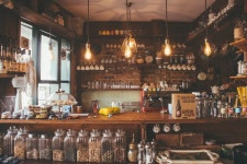 Download Cozy Brown Coffee Shop Interior Wallpaper | Wallpapers.com