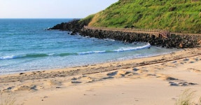 Download A stunning view of Hamdeok beach with a luminous sunrise in Jeju Island, South Korea. Wallpaper | Wallpapers.com