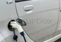 Electric car charging station to. symbol of ecology, environmental protection, innovation | Stock Photo | Colourbox