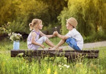 Cute boy and girl in love. They sitting ... | Stock image | Colourbox
