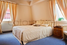 Beautiful interior of a modern bedroom with wide bed | Stock Photo | Colourbox
