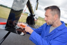 Avionics technician working | Stock Photo | Colourbox