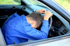 Young man fall asleep in a car | Stock Photo | Colourbox