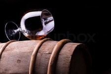 Cognac or brandy on a wooden barrel | Stock Photo | Colourbox