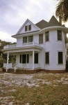 Florida Memory • Close-up view of a two story house in New Smyrna Beach. 