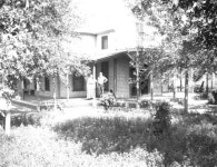 Florida Memory  - Man and woman posing on a porch - De Land, Florida Man and woman posing on a porch - De Land, Florida