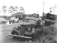 Florida Memory • Smashed-up car near service station. 