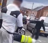 Sickening moment traffic warden is kicked on the ground by teen thugs who steal his moped | The Scottish Sun Traffic warden... 