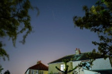 Swarm of Elon Musks Starlink internet satellites snapped soaring over Britain last night | The Irish Sun Swarm of Elon Musks... 