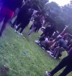 Horrifying moment knifeman with massive blade sprints through park before victim is stabbed as fair goers scream in fear | The... 