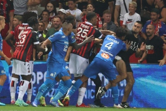 Dimitri Payet hit with bottle from crowd and fans STORM pitch to fight players as Nice clash with Marseille suspended | The Irish...
