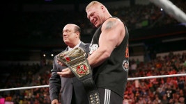 Triple H presents the new WWE World Heavyweight Championship to Brock Lesnar: photos | WWE Triple H presents the new WWE World... 