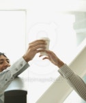 Man handing coffee to co-worker 이미지 (71416668) - 게티이미지뱅크 Man handing coffee to co-worker