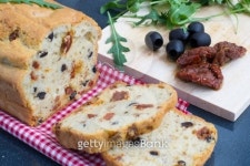 Snack bread with sun-dried tomatoes and black olives 이미지 (160949186) - 게티이미지뱅크 Snack bread with sun-dried tomatoes...