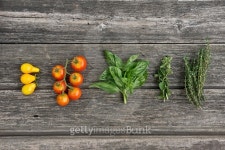 Herbs and tomatos on the wooden board 이미지 (522696687) - 게티이미지뱅크 Herbs and tomatos on the wooden board
