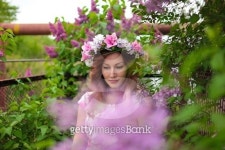 붙임머리블루밍위드미담장(Blooming with MIDAMJANG) | Beautiful woman in a wreath near the blooming lilac tree.... Beautiful woman in a wreath near the blooming lilac tree.