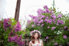 붙임머리블루밍위드미담장(Blooming with MIDAMJANG) | Beautiful woman in a wreath near the blooming lilac tree.... Beautiful woman in a wreath near the blooming lilac tree.