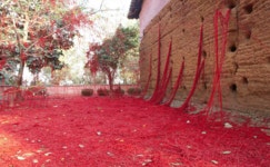 A Mass of Tangled Red Yarn Unravels from a Loom to Overtake a Brazilian Chapel | Colossal A Mass of Tangled Red Yarn Unravels...