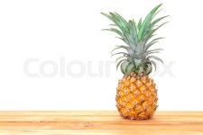 The pineapple fruit on wooden table ... | Stock image | Colourbox