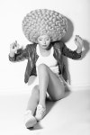 Creativity. Trendy Woman in Huge Fancy Wig sitting on Floor | 유토이미지 | 상세페이지 | 베이직샵 | 사진 | 19515436