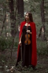 첼로수녀복 | elegant beautiful woman in black dress and red cloak holding violin in forest | 유토이미지 | 상세페이지 | 베이직샵 | 사진...