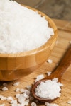 Large white sea salt in a wooden bowl — Stock Photo © 5PH #116555224 Large white sea salt in a wooden bowl