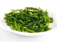 Fried spinach cabbage. Close up on white background | Stock Photo | Colourbox