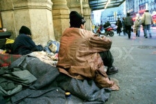 Homeless people sitting on the street | Stock Photo | Colourbox