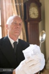 Butler polishing spoon, low angle view - 당신의 크리에이티브 파트너, 이미지사이트 윤익이미지 YOONIQ Images RF #216115666