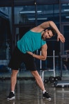 athletic man stretching in sports hall | 유토이미지 | 상세페이지 | 베이직...