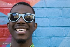 Close up of Black man wearing colorful sunglasses - 당신의 크리에이...